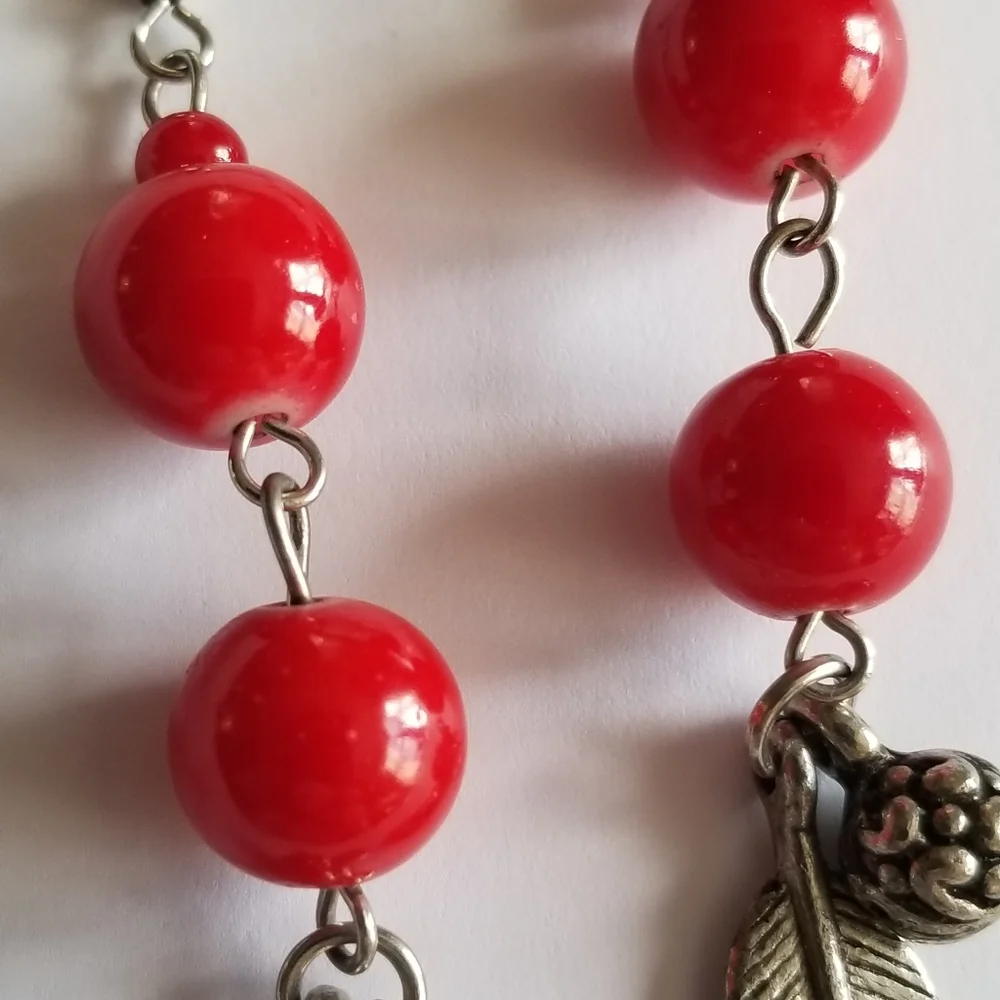 Feather earrings with red beads and flower ball beads silver tone boho